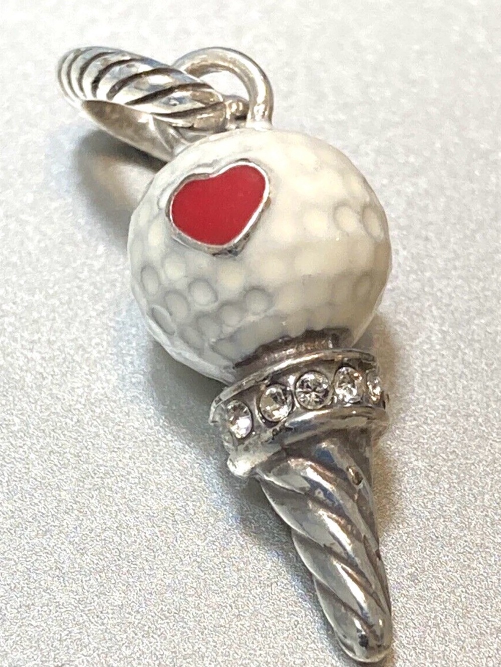 Brighton Golf Girl charm featuring a silver-plated golf ball on a tee